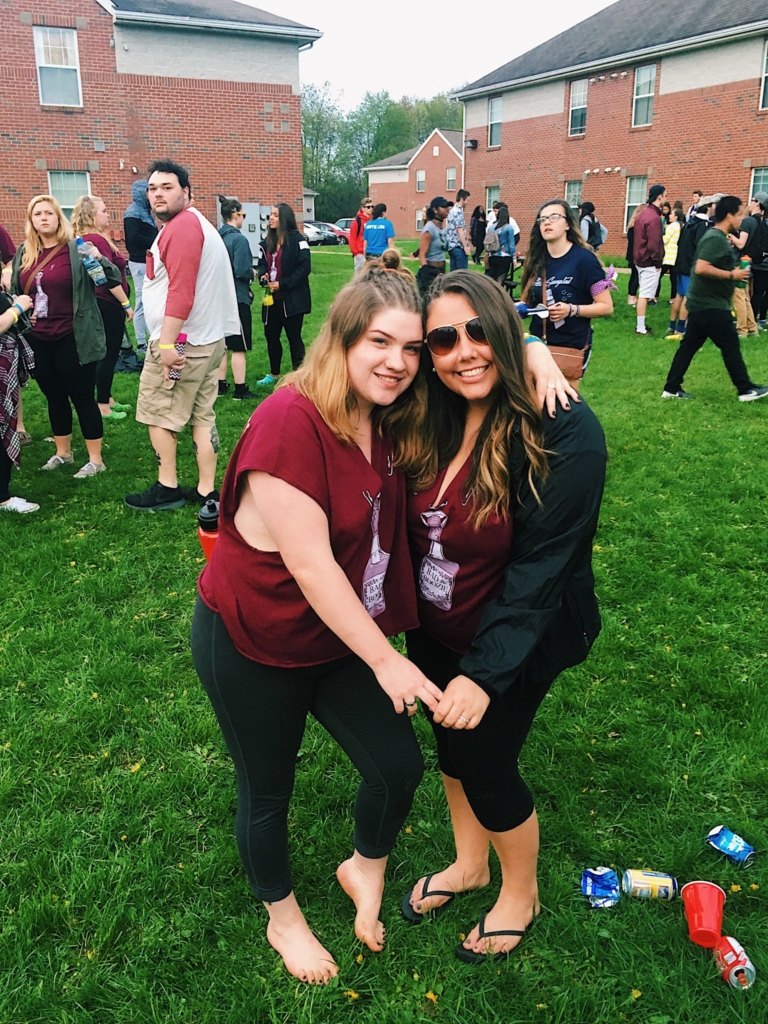  Graduate student Cori-Anne Fagan (left) and alumna Katie Denmark (right), both 21 and on-campus residents at the time, pose for a photo during the annual quad party The administration has since condemned the party after concerns about underage drinking and property damage were raised.