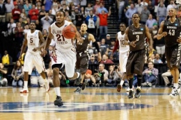 Kevin C. Cox/Getty Images: Senior Da'Quan Cook completes a dunk against Florida State.