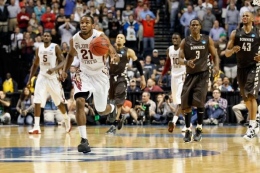 Kevin C. Cox/Getty Images: Senior Da'Quan Cook completes a dunk against Florida State.