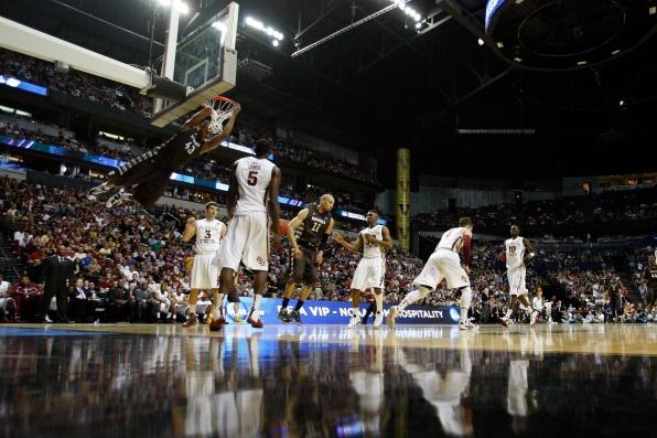 Kevin C. Cox/Getty Images: Redshirt senior Da'Quan Cook completes a dunk against Florida State.