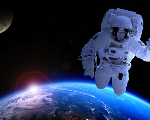 astronaut floating in space above the Earth