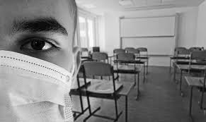 Student in classroom wearing COVID-19 mask