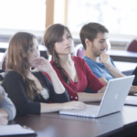 Students in a classroom on their laptops